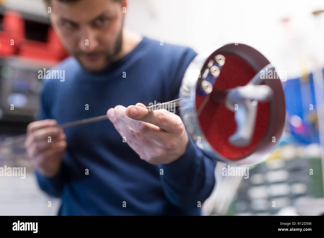 Fencing prop maker at work Stock Photo