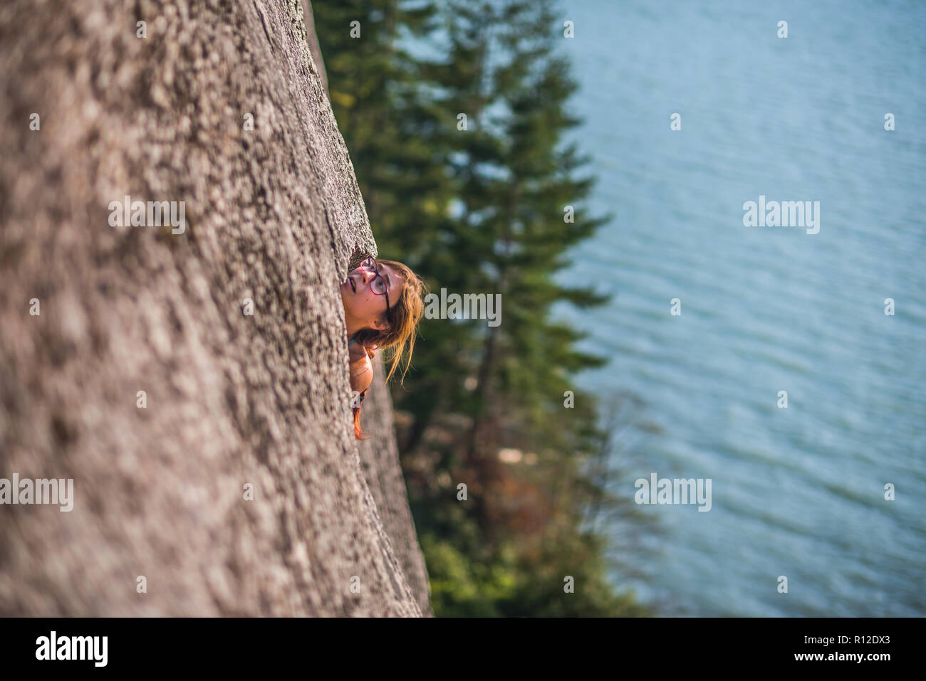 Woman rock climbing, Malamute, Squamish, Canada Stock Photo