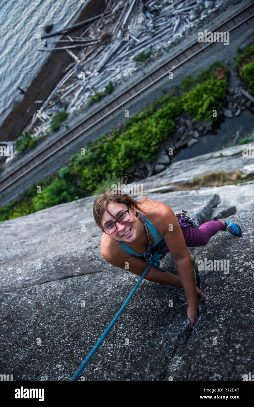 Woman rock climbing, Malamute, Squamish, Canada Stock Photo