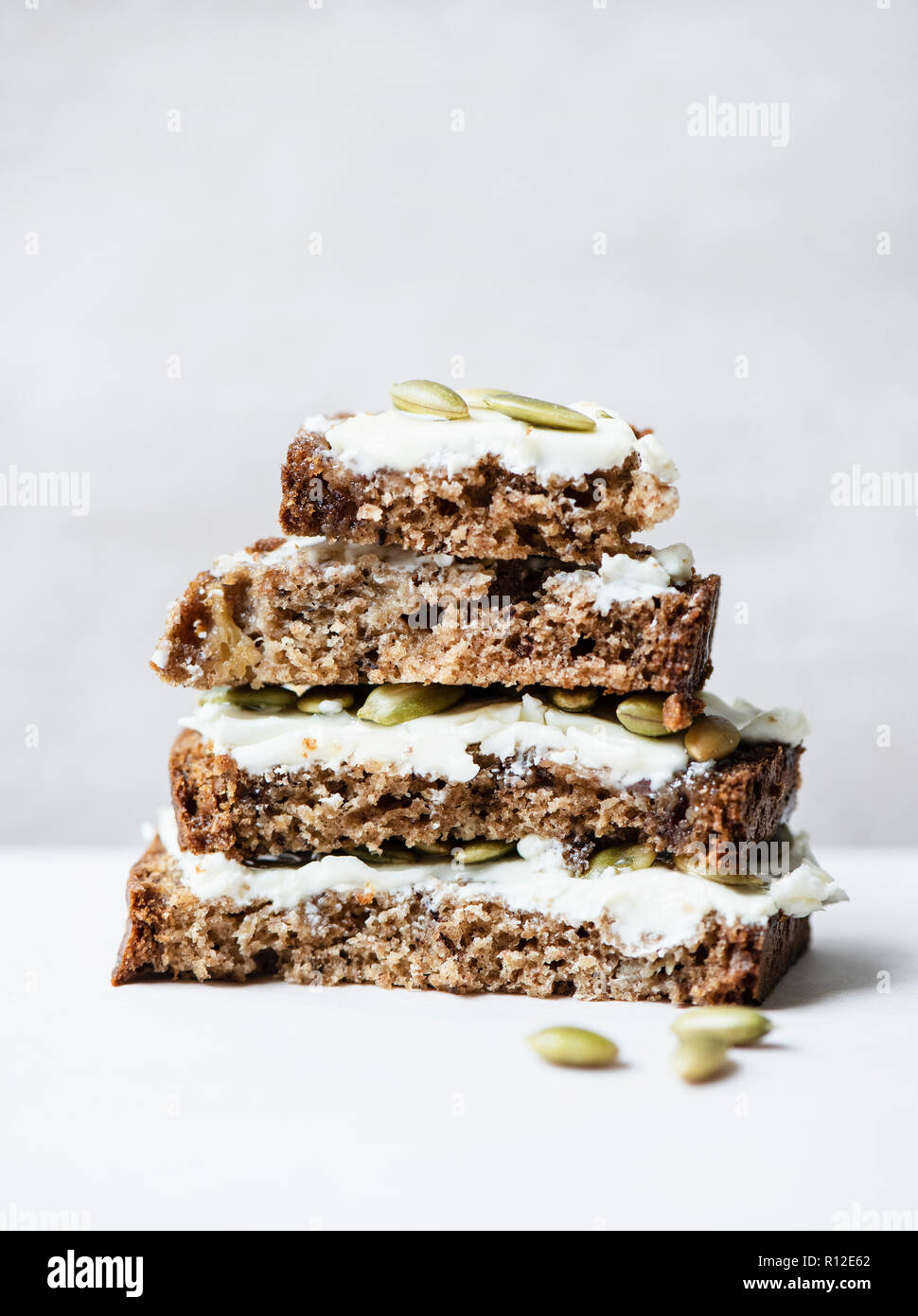 Banana bread slices with cream cheese frosting Stock Photo