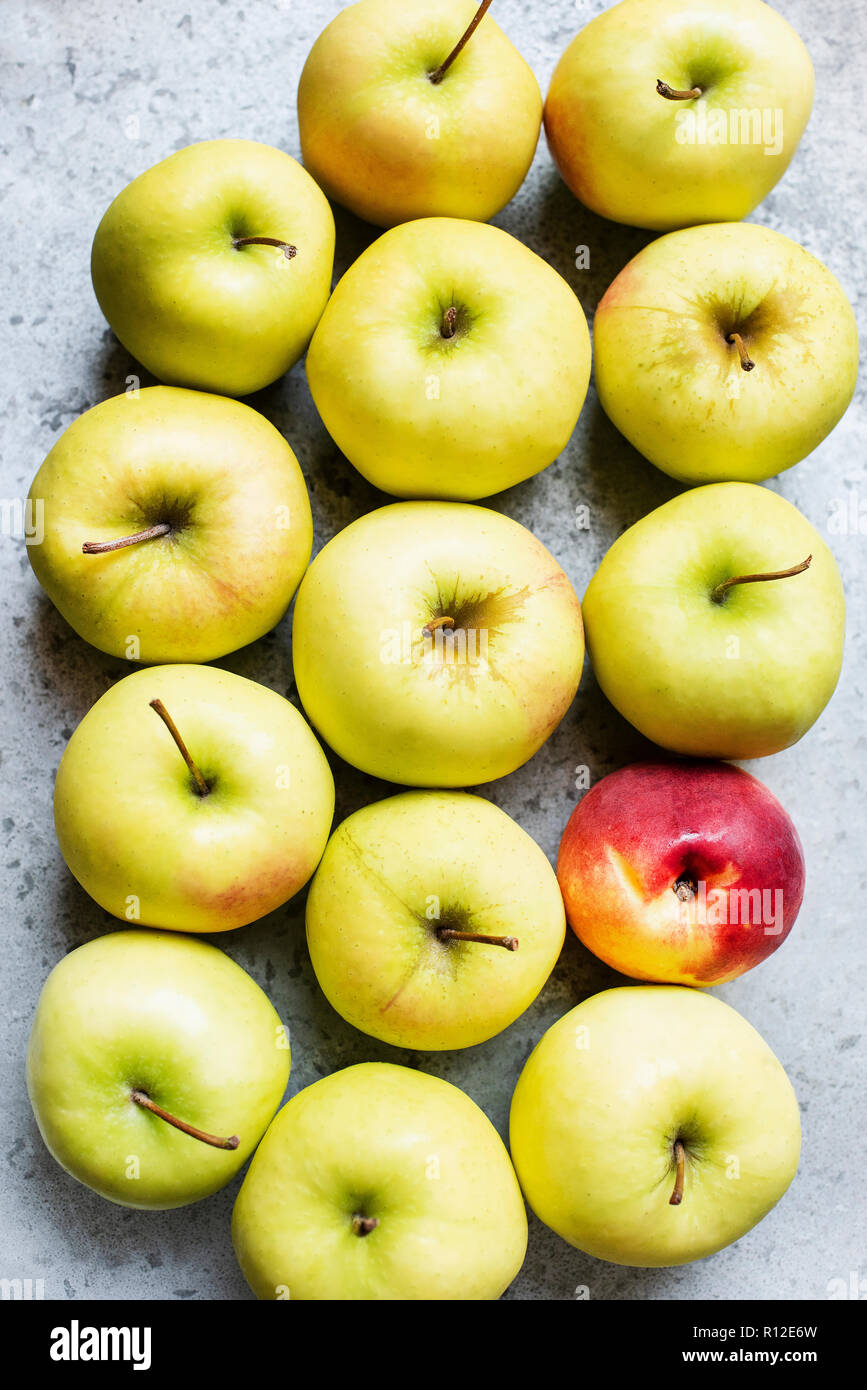 Golden apples and one peach Stock Photo