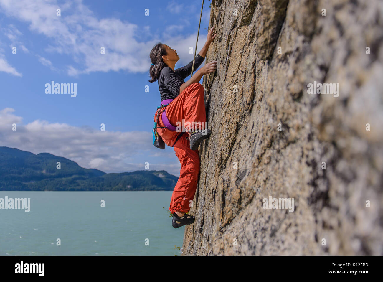 Woman rock climbing, Squamish, Canada Stock Photo
