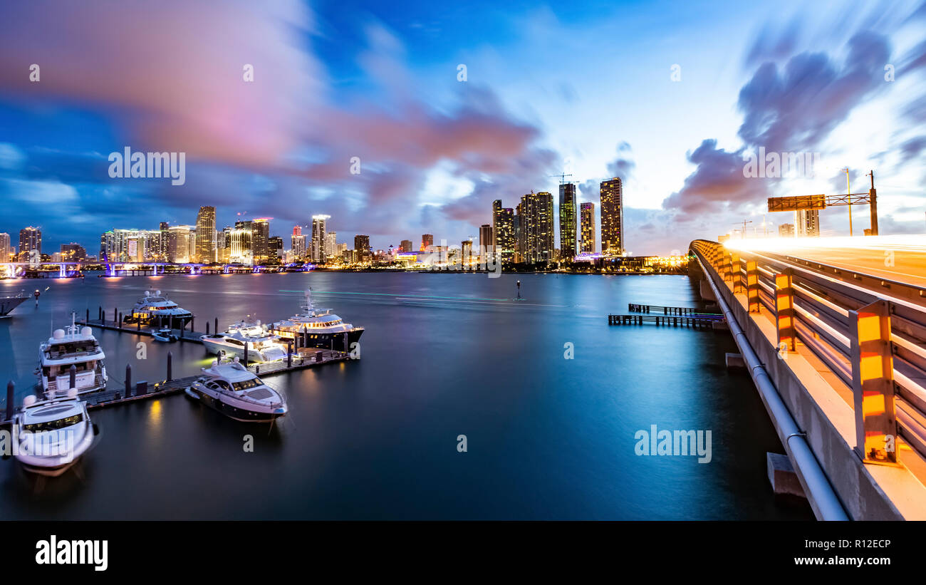 Boats moored at dock, cityscape in background, Miami, Florida, USA Stock Photo
