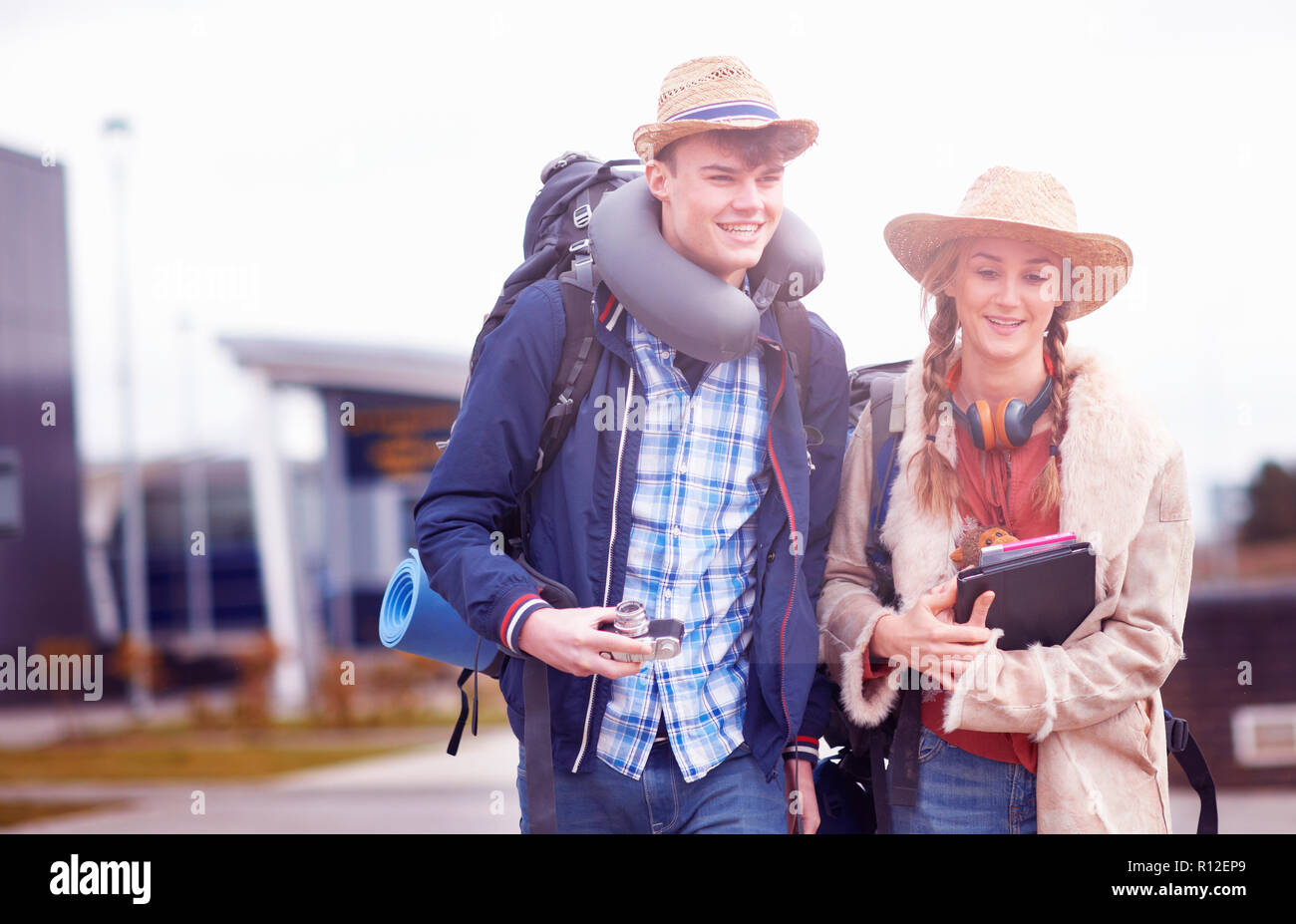 Backpacker couple at airport Stock Photo Alamy