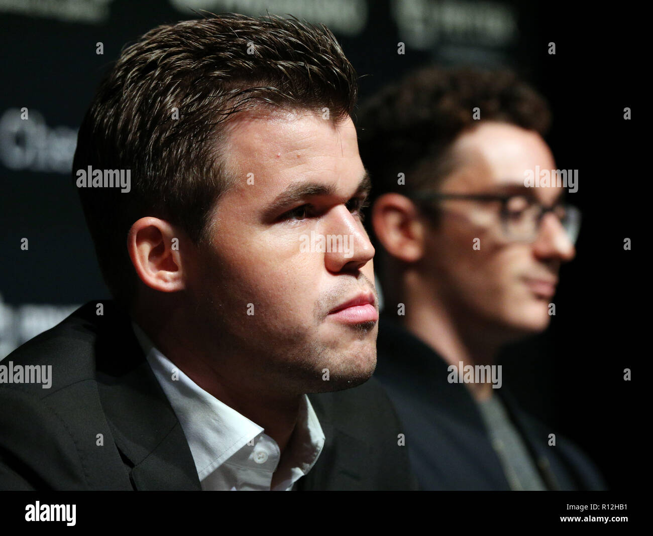 Reigning FIDE world chess champion Magnus Carlsen (right), defends his  title against US challenger Fabiano Caruana, during the first game of the  FIDE World Chess Championship at The College, Southampton Row in