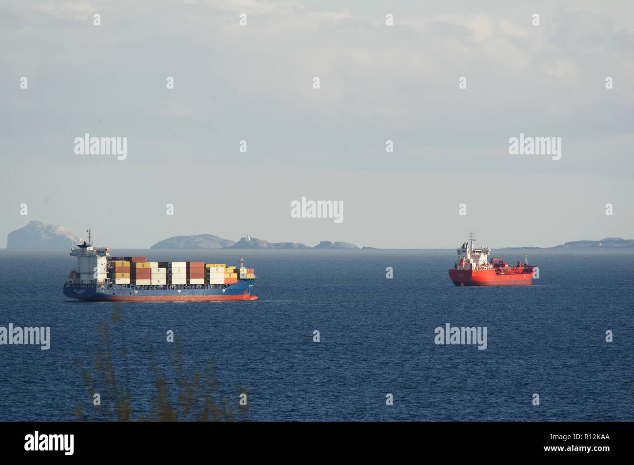 Commercial ships anchored off the east coast of Scotland in the Firth of Forth. Stock Photo
