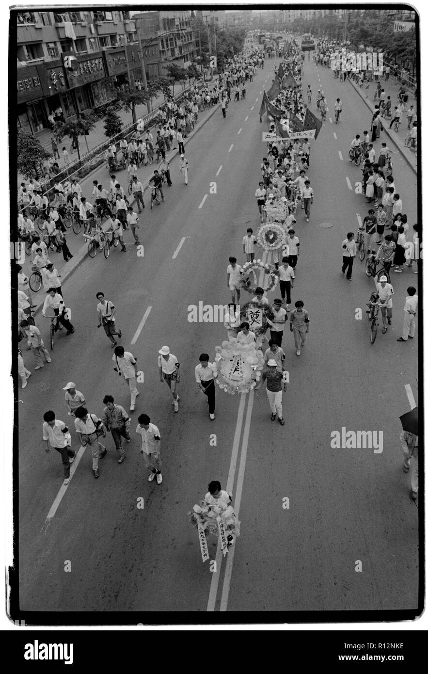 China Shanghai a few days after the massacre in Tiananmen Square in June 1989. Scans made in 2018 Students march through the centre of Shabghai in protest at the deaths of their fellow students in Beijing a few days earlier Stock Photo