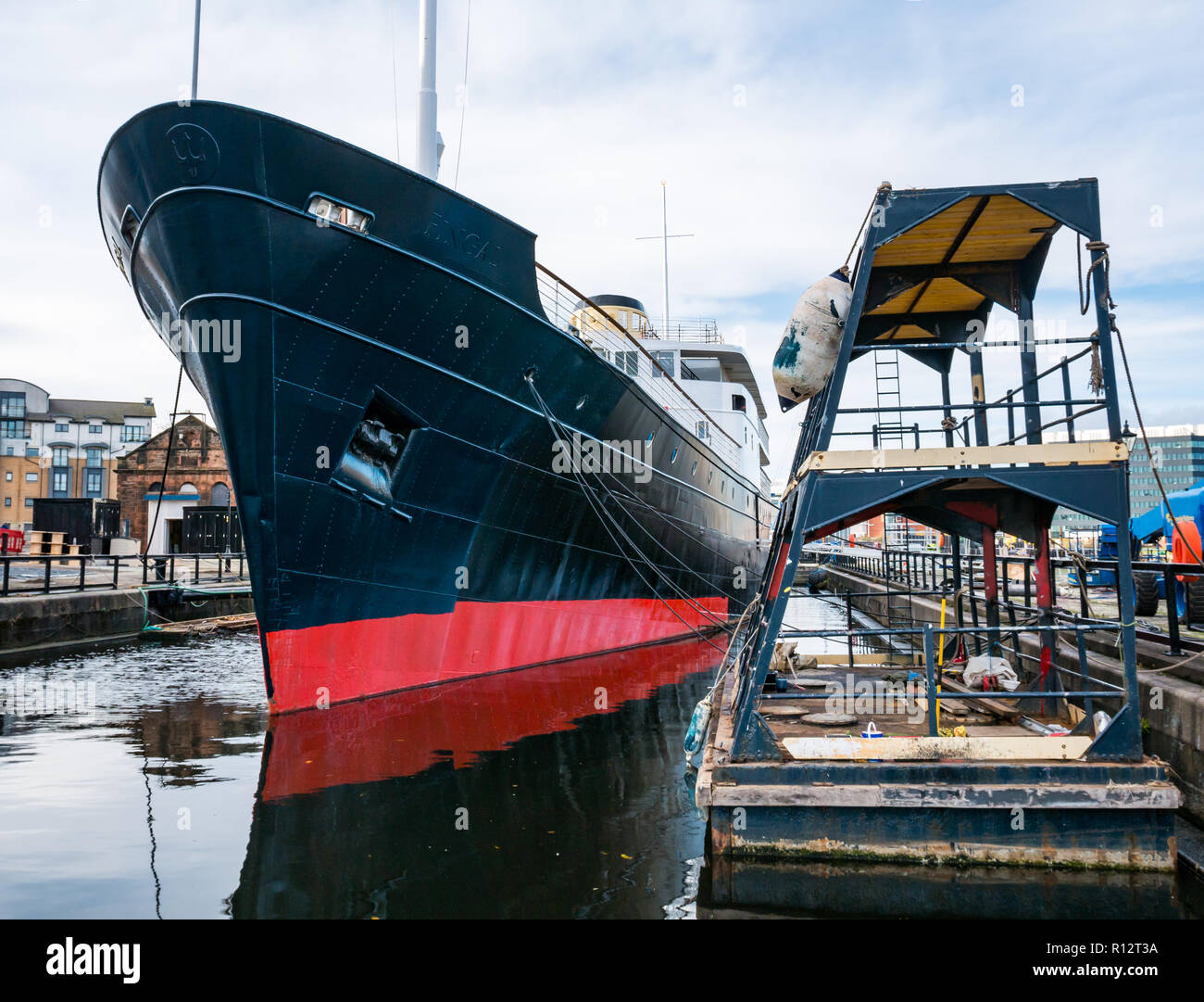 Leith, Edinburgh, Scotland, United Kingdom, 8th November 2018. Royal Yacht Britannia floating hotel moves to permanent mooring: MV Fingal, former lighthouse tender ship has been repainted and moved to Alexandra Dock in the historic Port of Leith. It has been undergoing a refit to transform it into a 23 bedroom hotel. Construction work is going on to create an entrance site. The 5 star luxury floating hotel will open in January 2019 Stock Photo