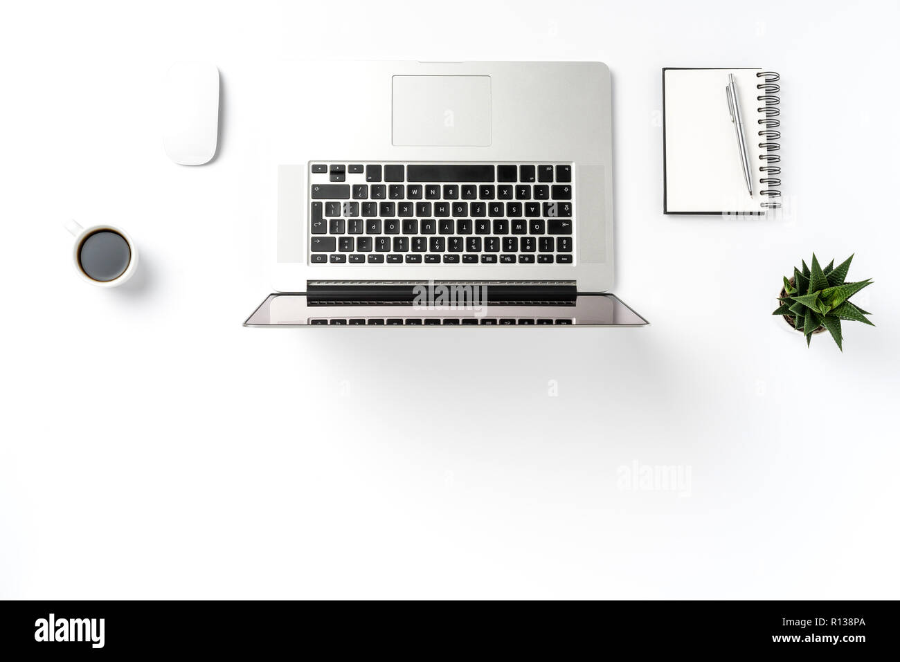 Office desktop with laptop and accessories Stock Photo