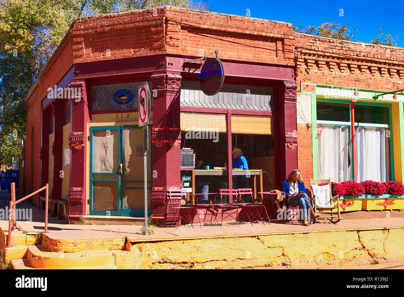 Woman sitting outside the Yankie Creek Coffee House on W. Yankie Street