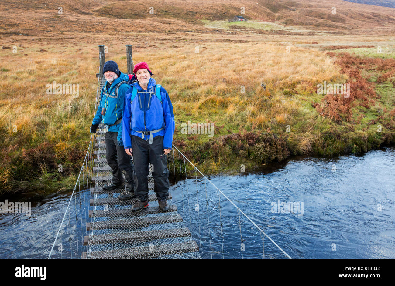 The suspension bridge across the Lon Mor in Strath Shinary giving ...