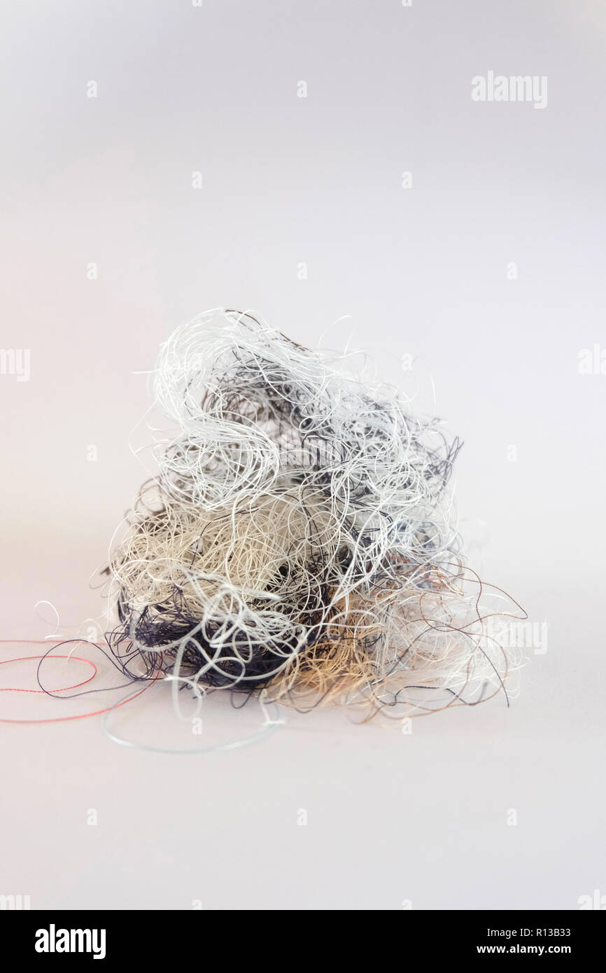 Tangled mess of sewing thread Stock Photo