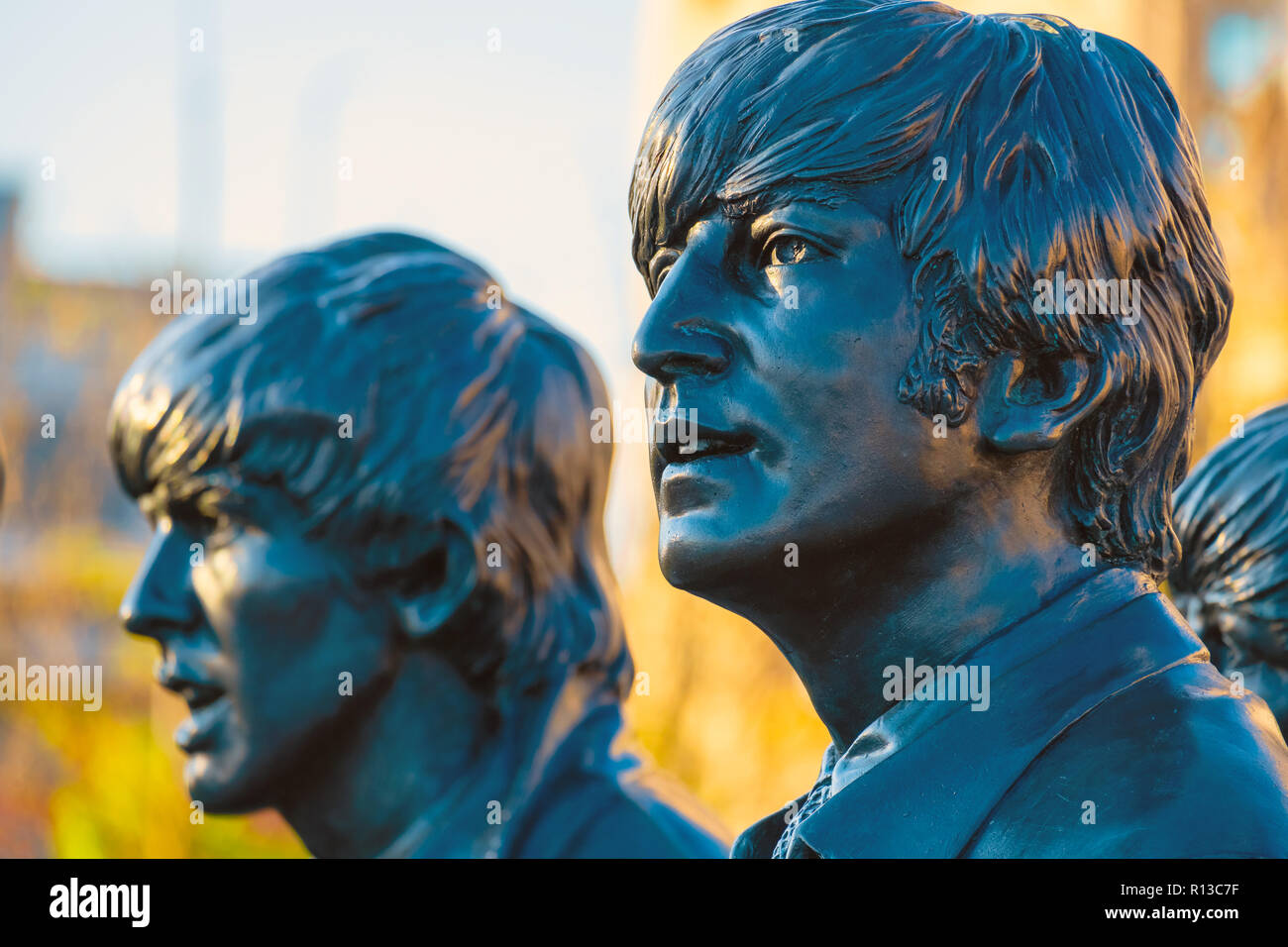 Liverpool, UK - May 17 2018: Bronze statue of the  Beatles stands at the Pier Head on the side of River Mersey, sculpted by Andrew Edwards and erected Stock Photo