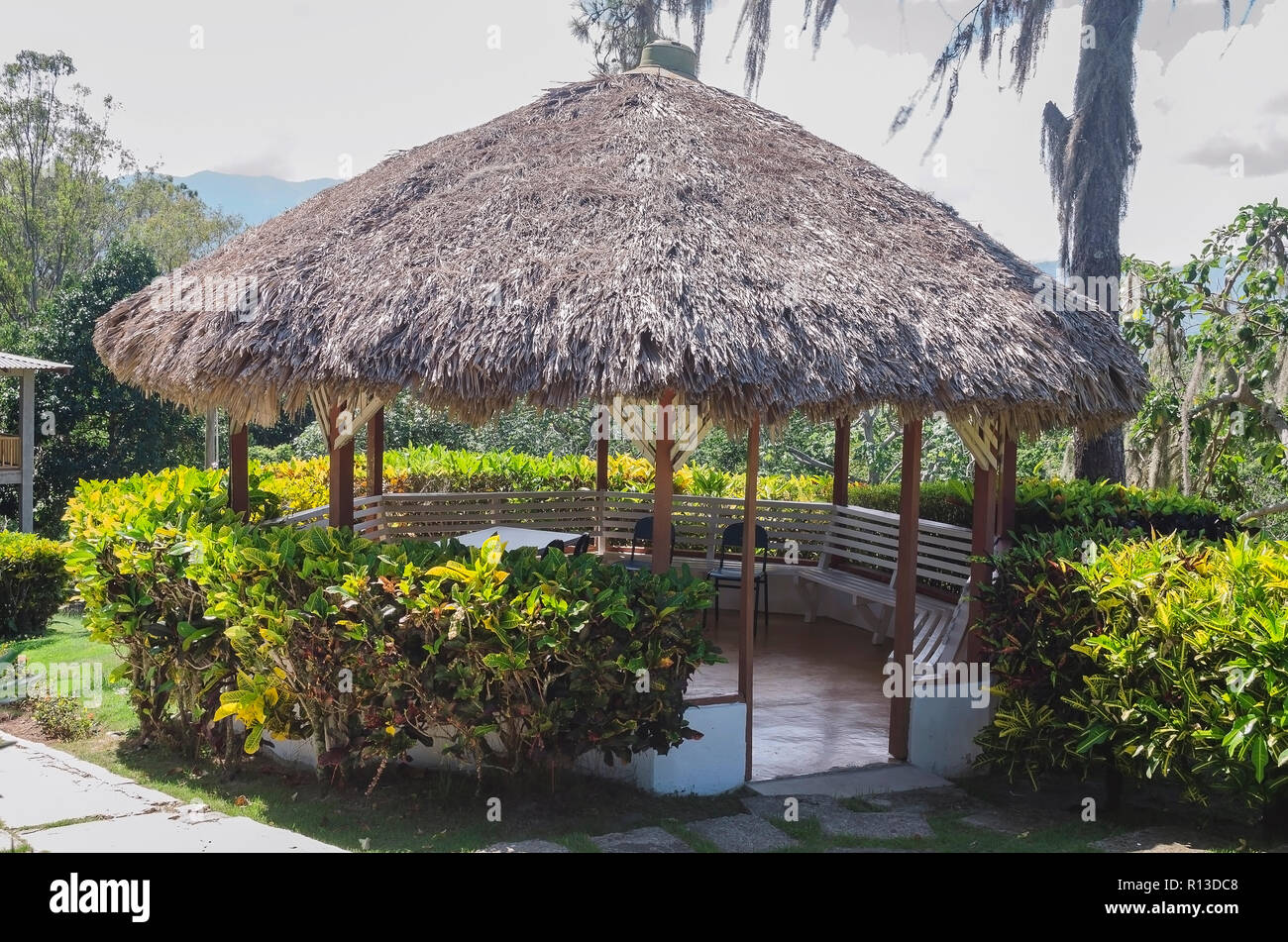 Traditional gazebo roofed in palm tree mountains to enjoy the cool breeze and landscape, Dominican Republic, Santiago Stock Photo