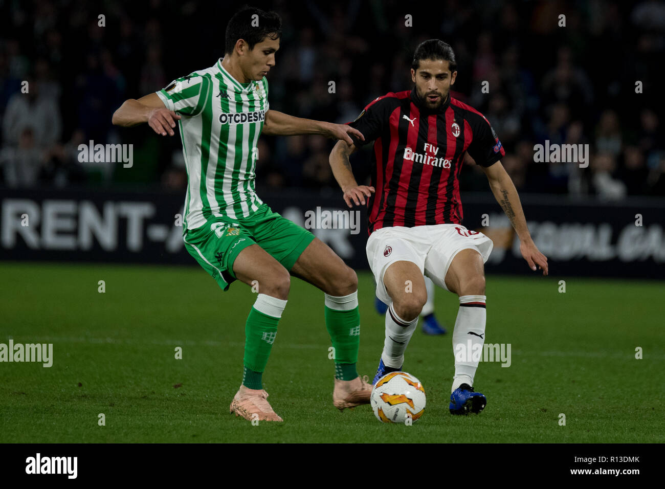 Sevilla, Spain. 08th Nov, 2018. Aissa Mandi, Betis, and Ricardo Rodriguez, Milan, fight for the ball during the Europa League match Real Betis vs AC Milan Credit: Javier Montaño/ Pacific Press/Alamy Live News Stock Photo