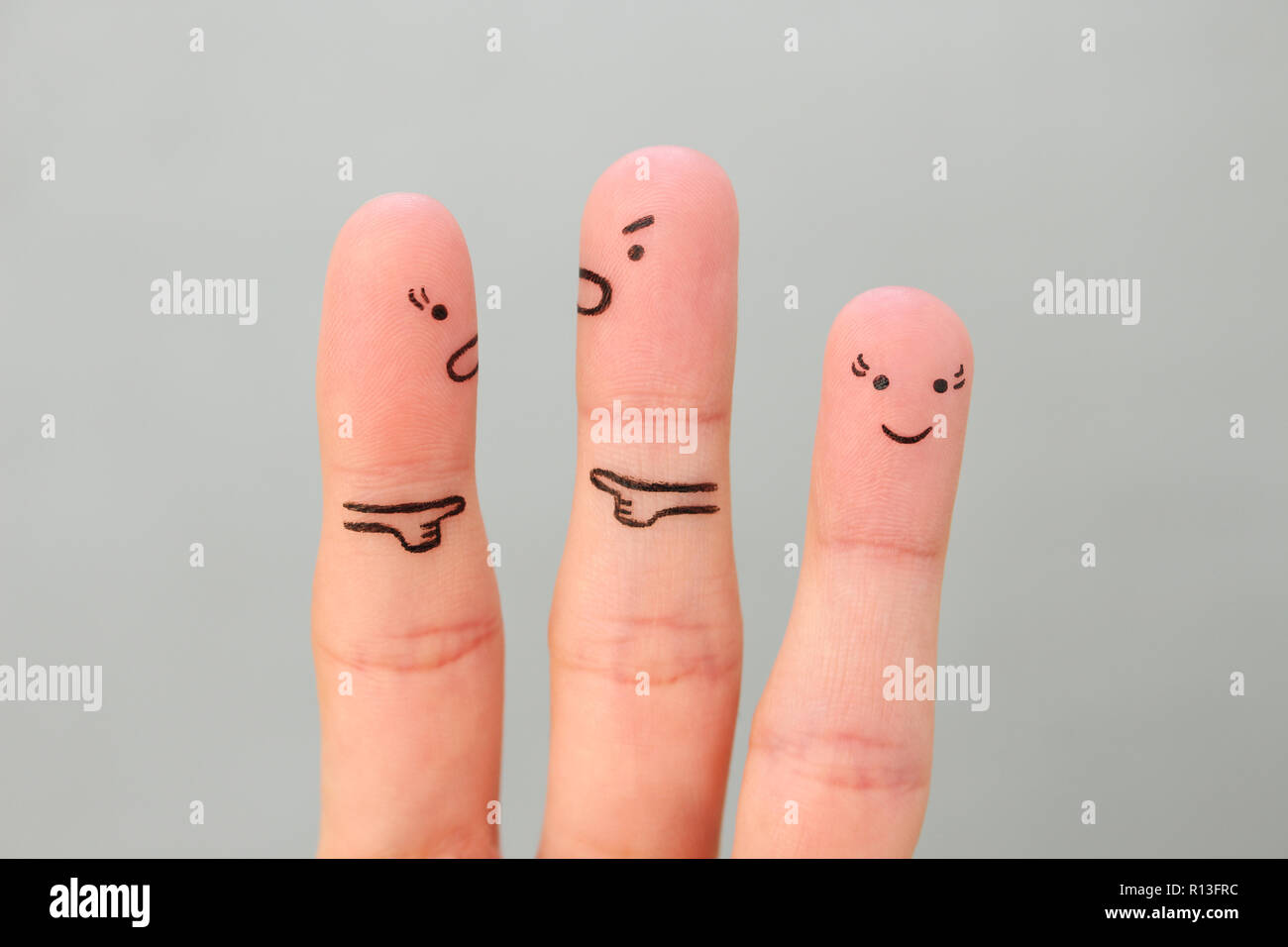 Fingers art of couple during quarrel. Another woman is happy. Stock Photo