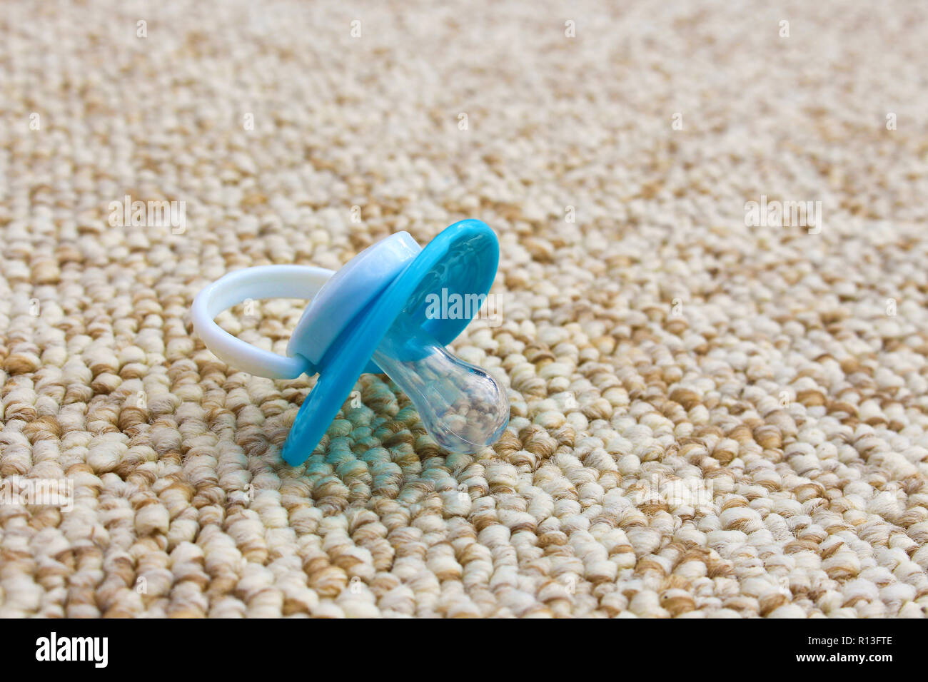 Baby pacifier fell on the dirty floor Stock Photo Alamy
