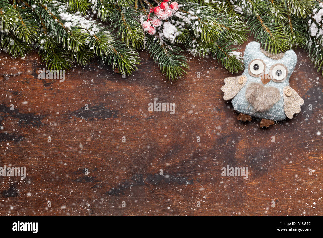 Christmas greeting card with decor and fir tree branch covered by snow ...