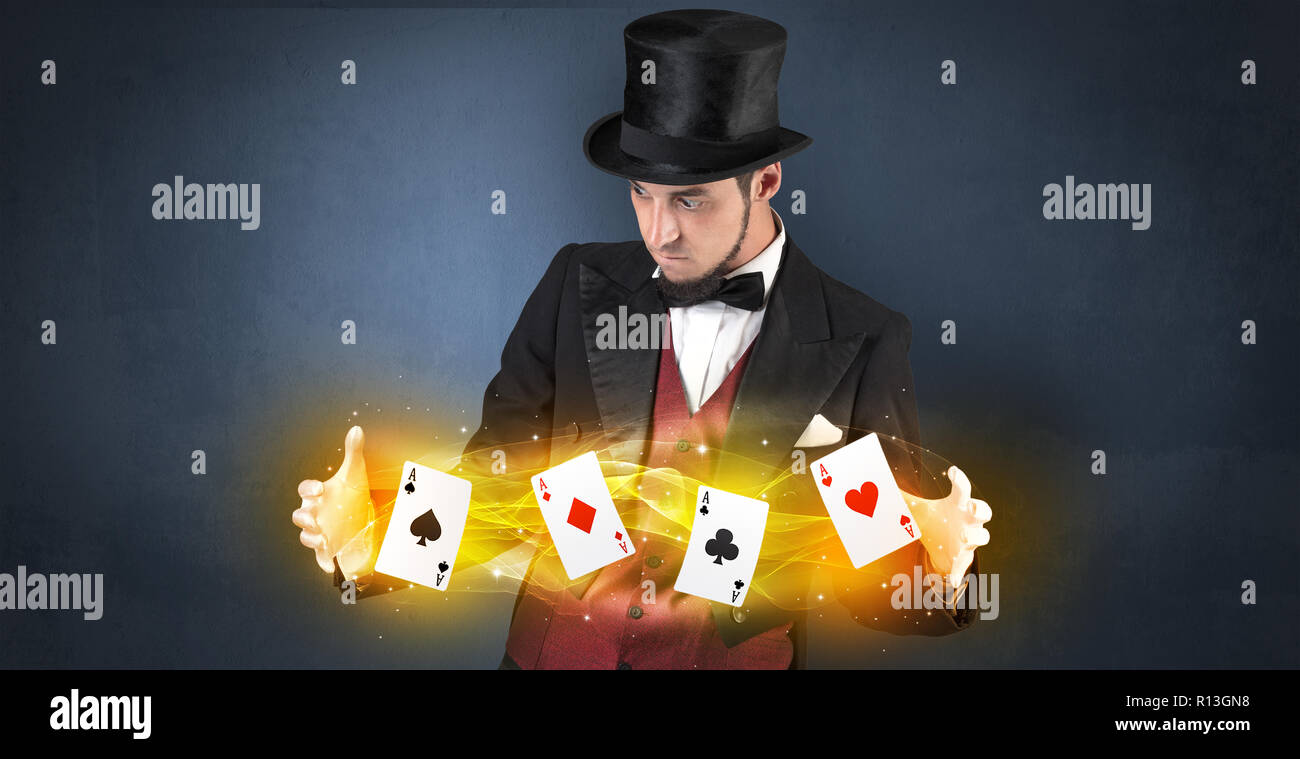 Illusionist in tails bandy play cards between his two hands Stock Photo ...