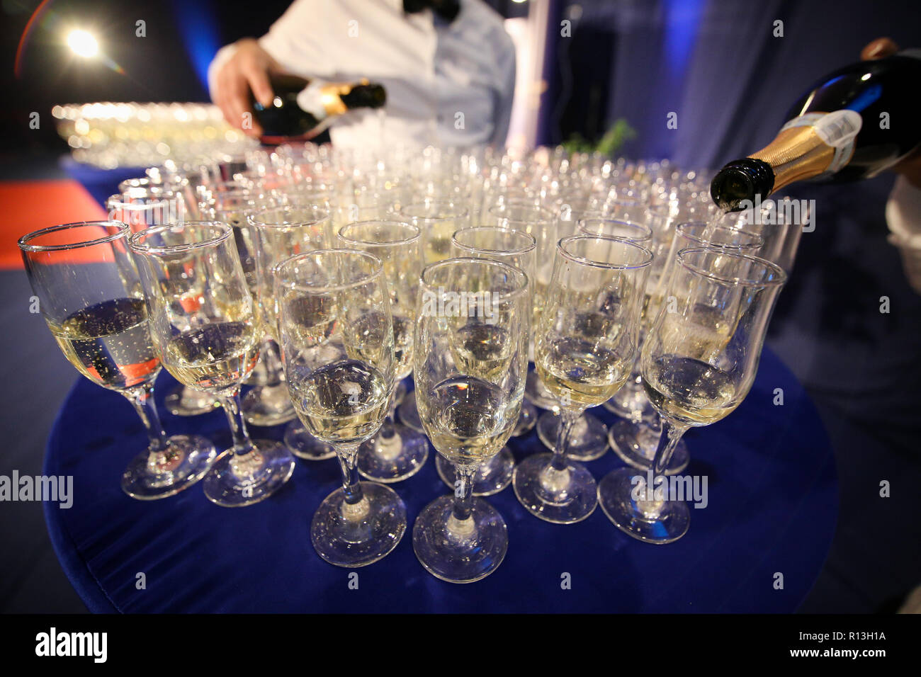 Details with glasses of champagne awaiting to be served to people