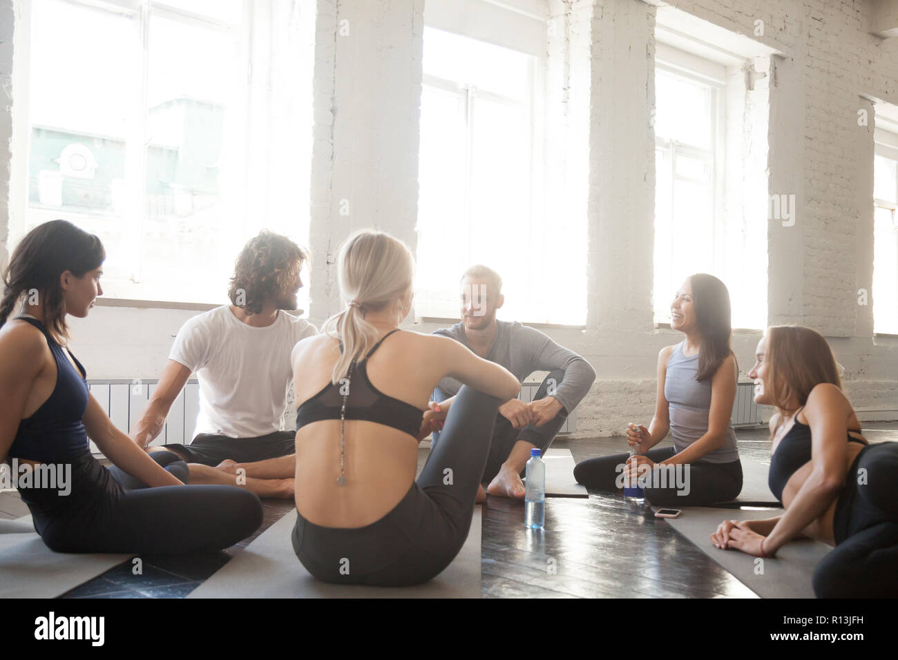 Athlete community talking in a circle during a break Stock Photo