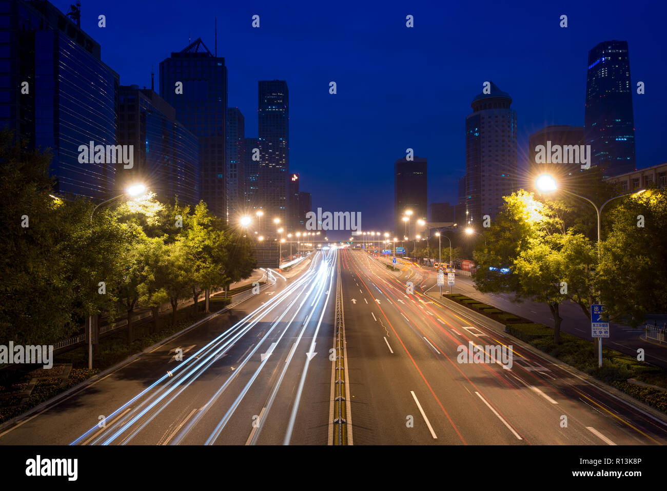 Light trails on the street at Beijing Central Business district at night in Beijing ,China. Stock Photo