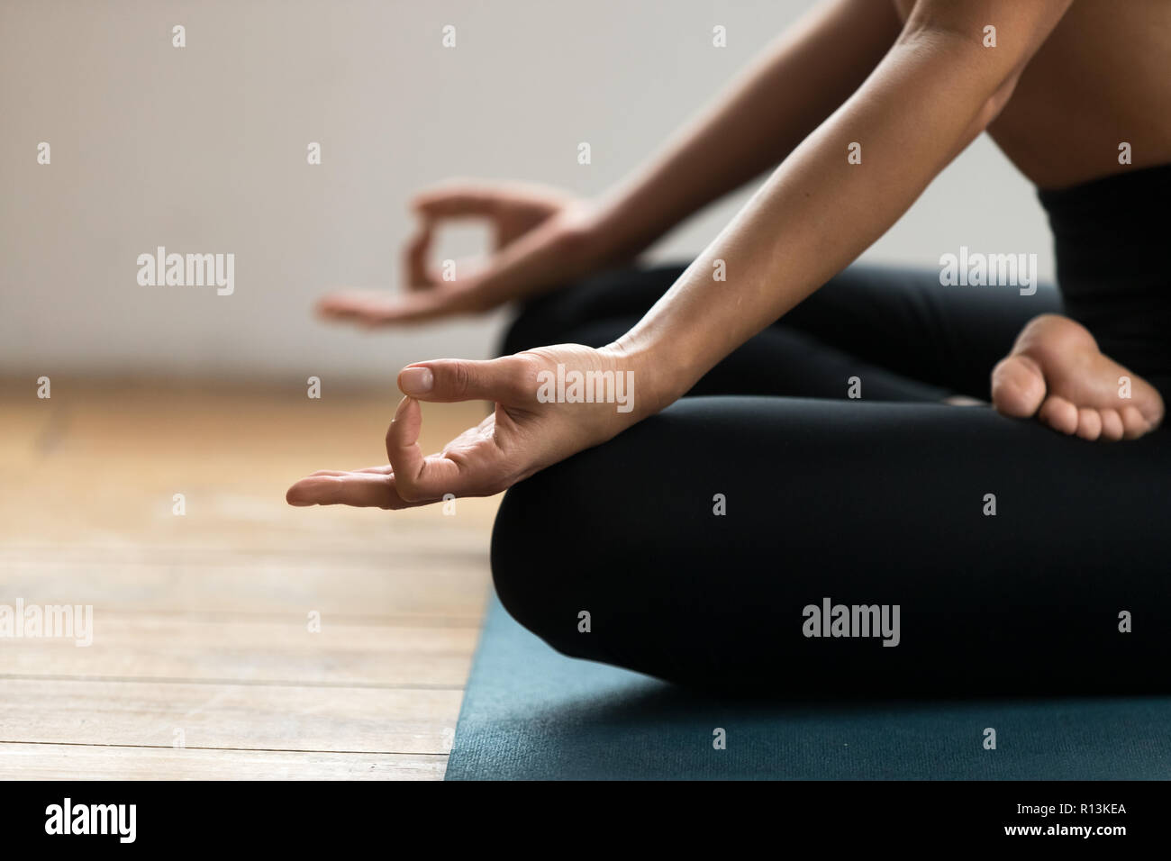 Half Lotus pose with mudra gesture close up Stock Photo Alamy