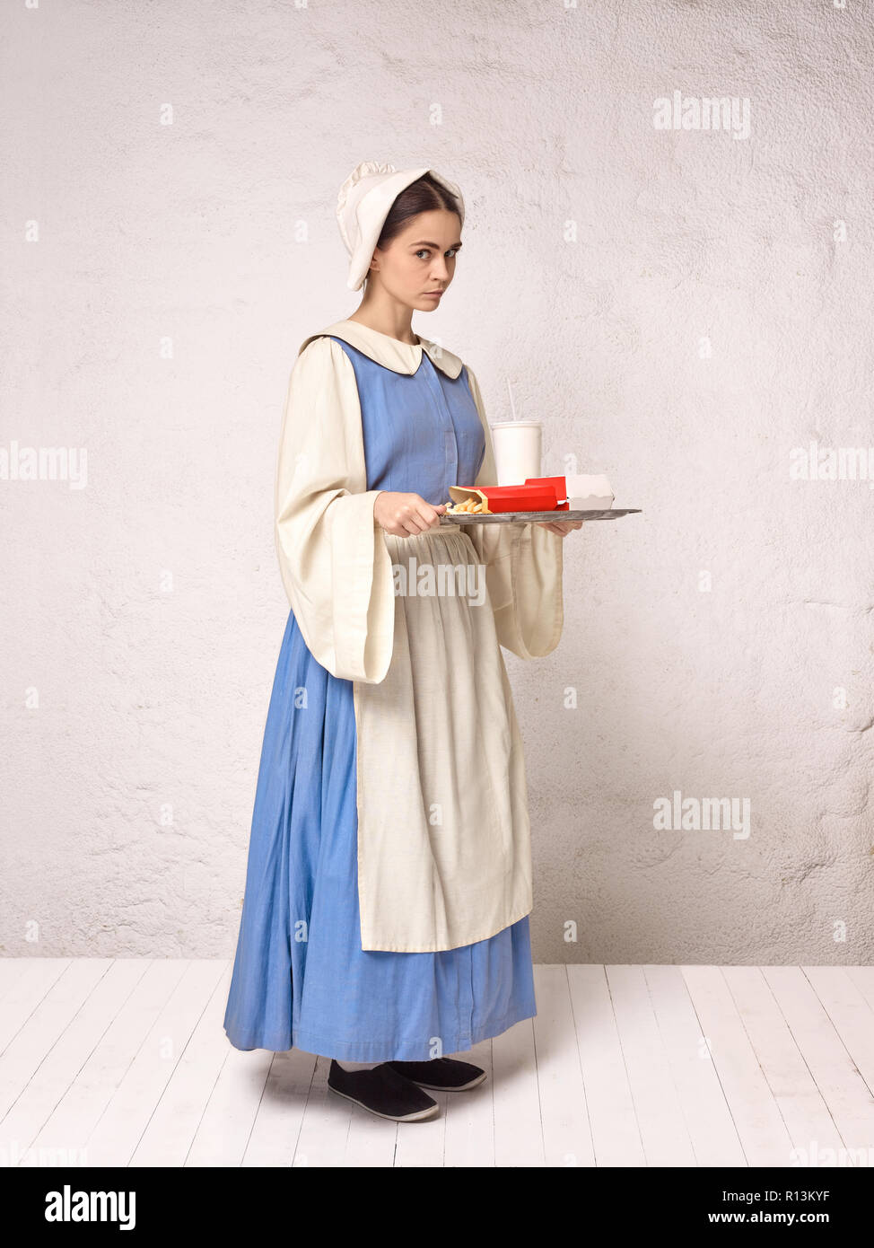 Medieval Woman in Historical Costume Wearing Corset Dress and Bonnet.  Beautiful peasant girl wearing thrush costume Stock Photo - Alamy