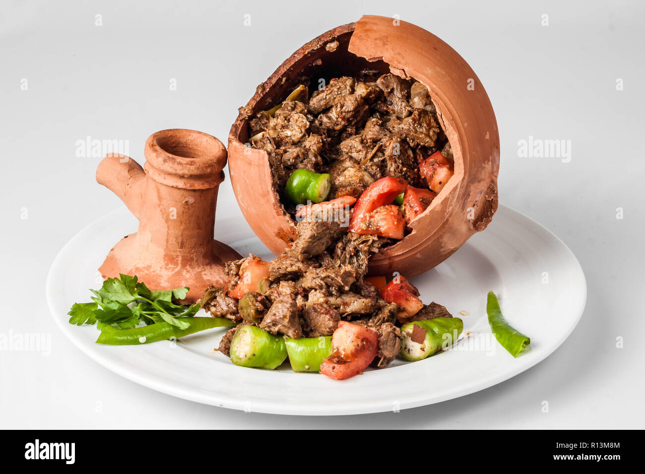 Authentic Turkish Testi Kebab cooked in earthenware waterjug Stock Photo