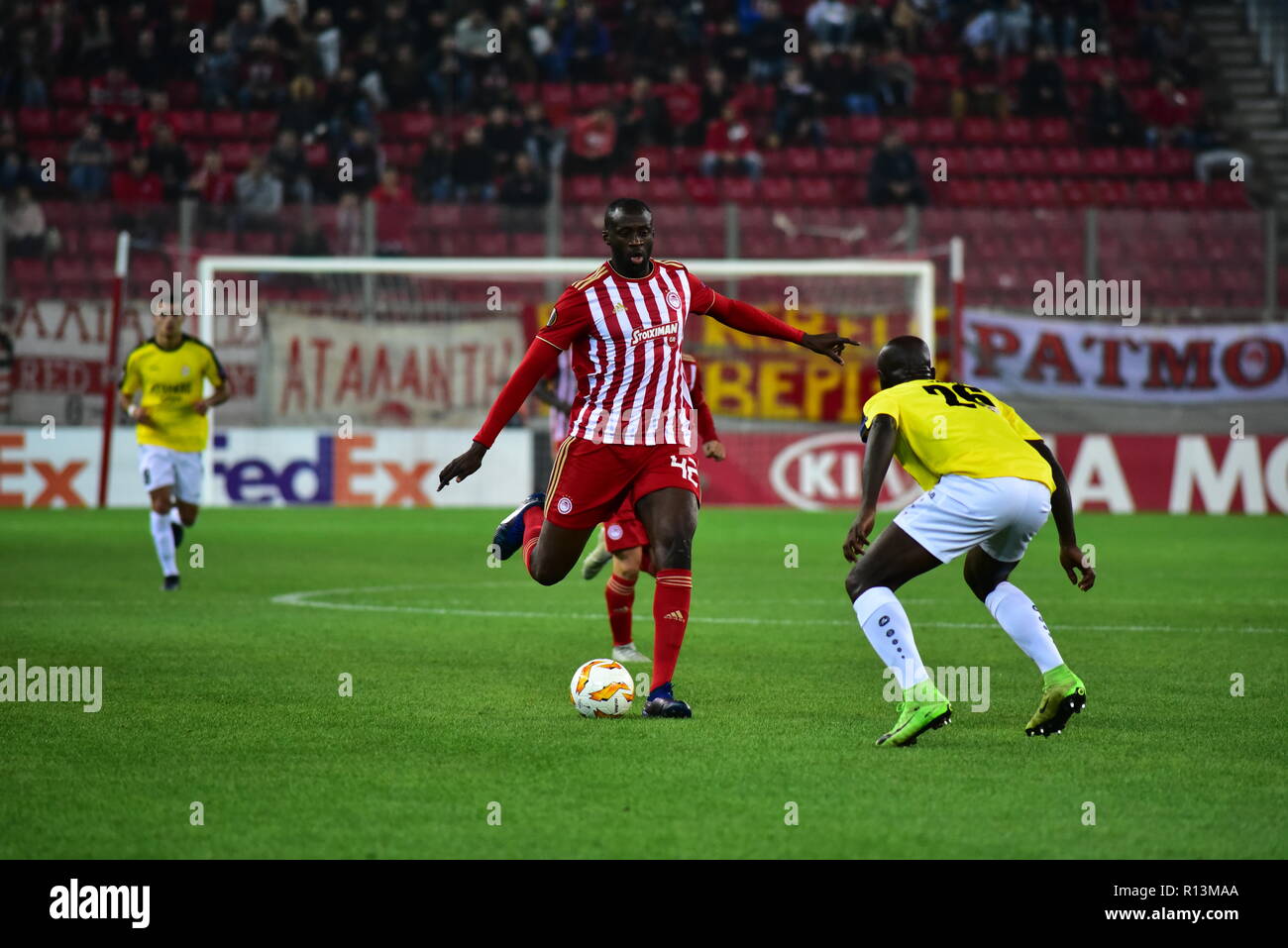 Athens, Greece. 08th Nov, 2018. Yaya Toure (no 42) of Olympiacos, tries to  pass the ball under the pressure of Jerry Prempeh (no 26) of F91 Dudelange.  Olympiacos has won F91 Dudelange