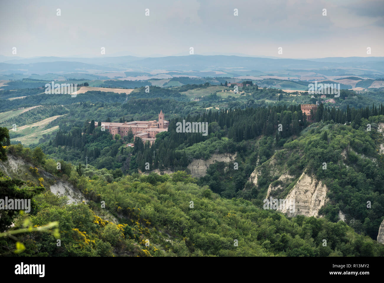 The Abbey of Monte Oliveto Maggiore (Benedictine monastery) and its surrounding areas, Tuscany, Italy Stock Photo