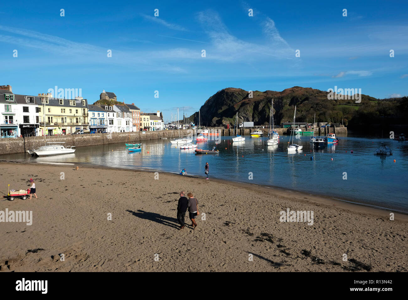 Ilfracombe harbour North Devon showing sandy beach in the bay looking toward the harbour mouth in early winter Stock Photo