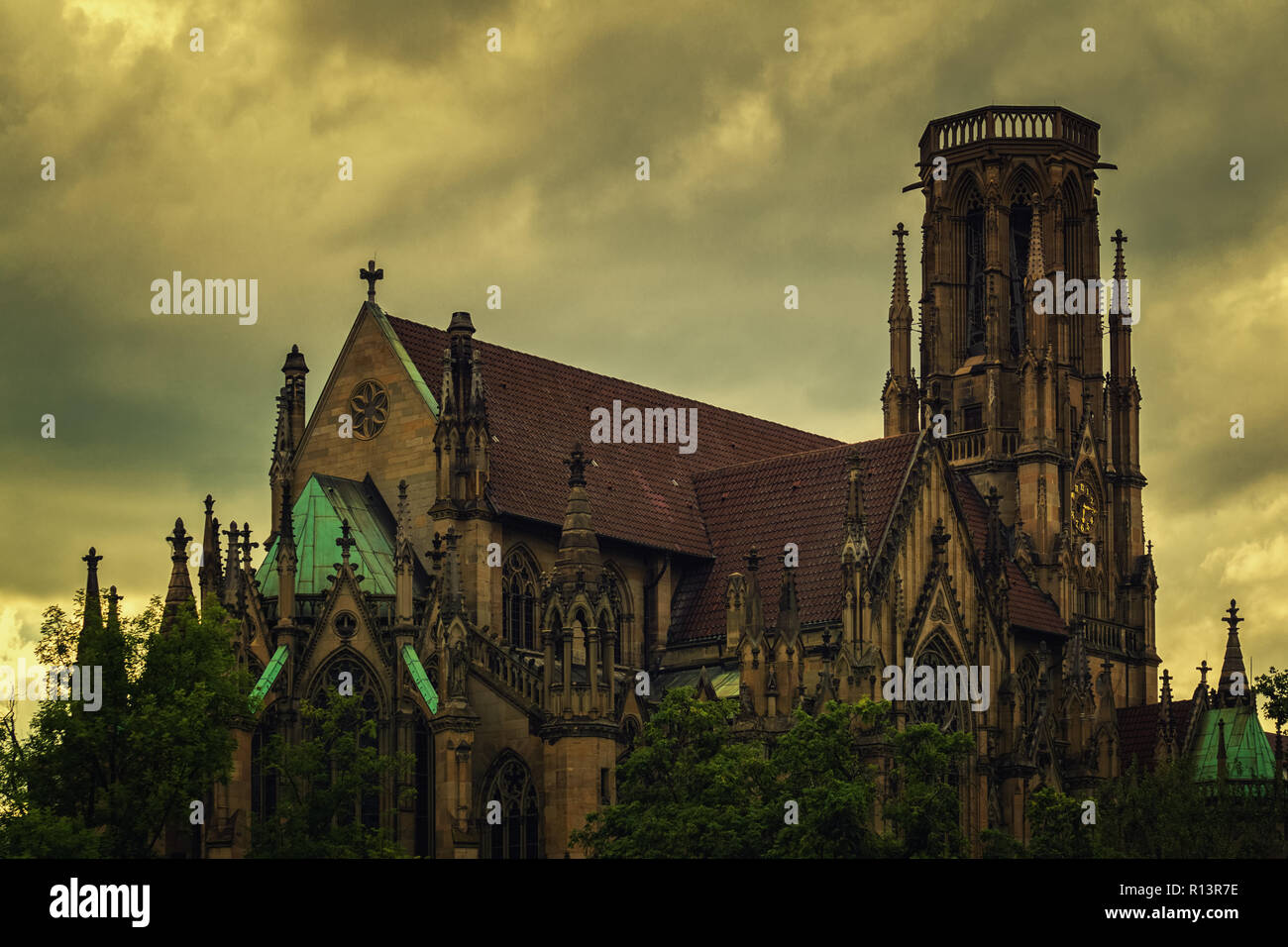 An old gothic church below a cloudy sky Stock Photo - Alamy