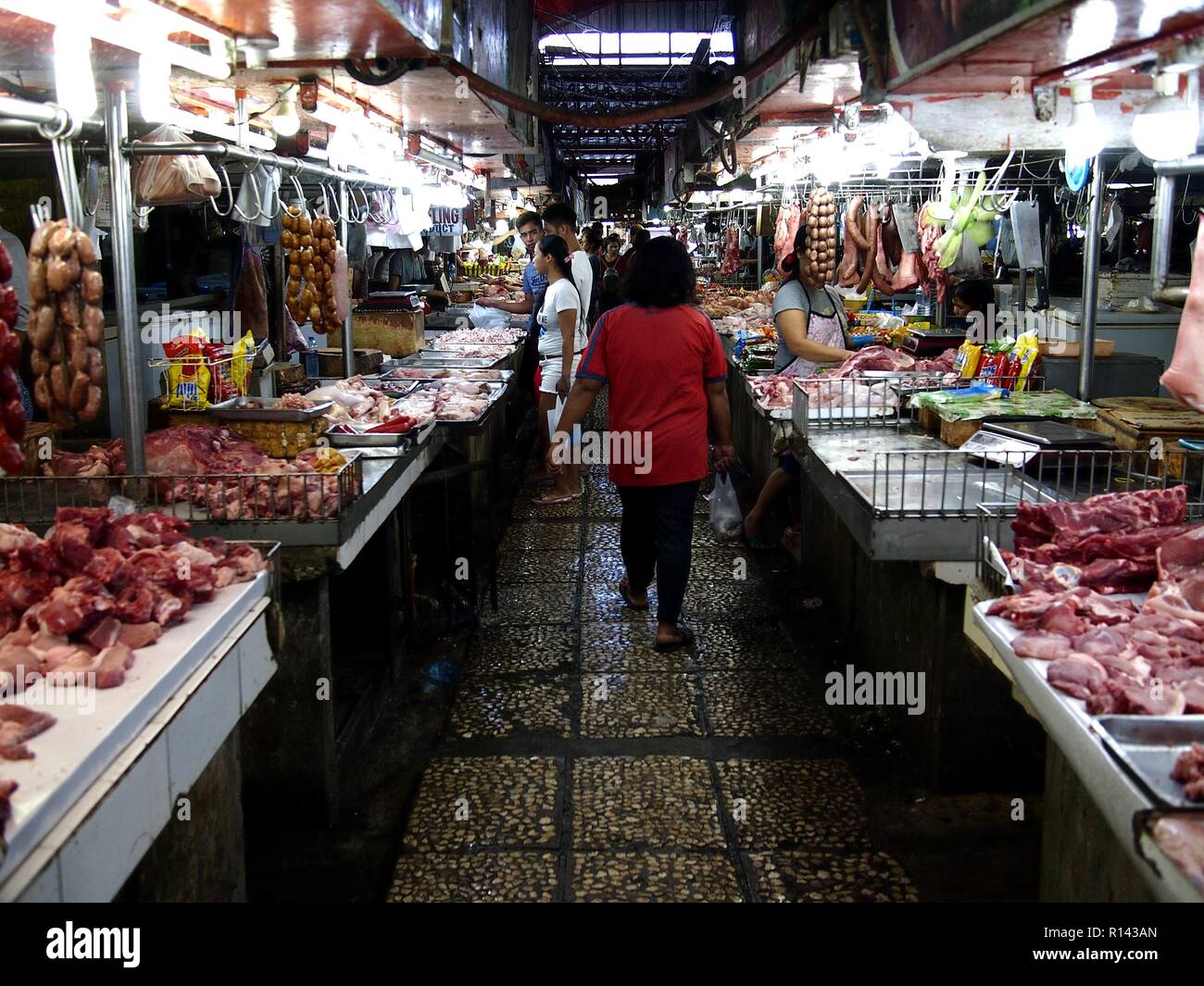 BINANGONAN, RIZAL, PHILIPPINES - NOVEMBER 8, 2018: Rows of fresh meat and fish vendor stalls at a public market. Stock Photo