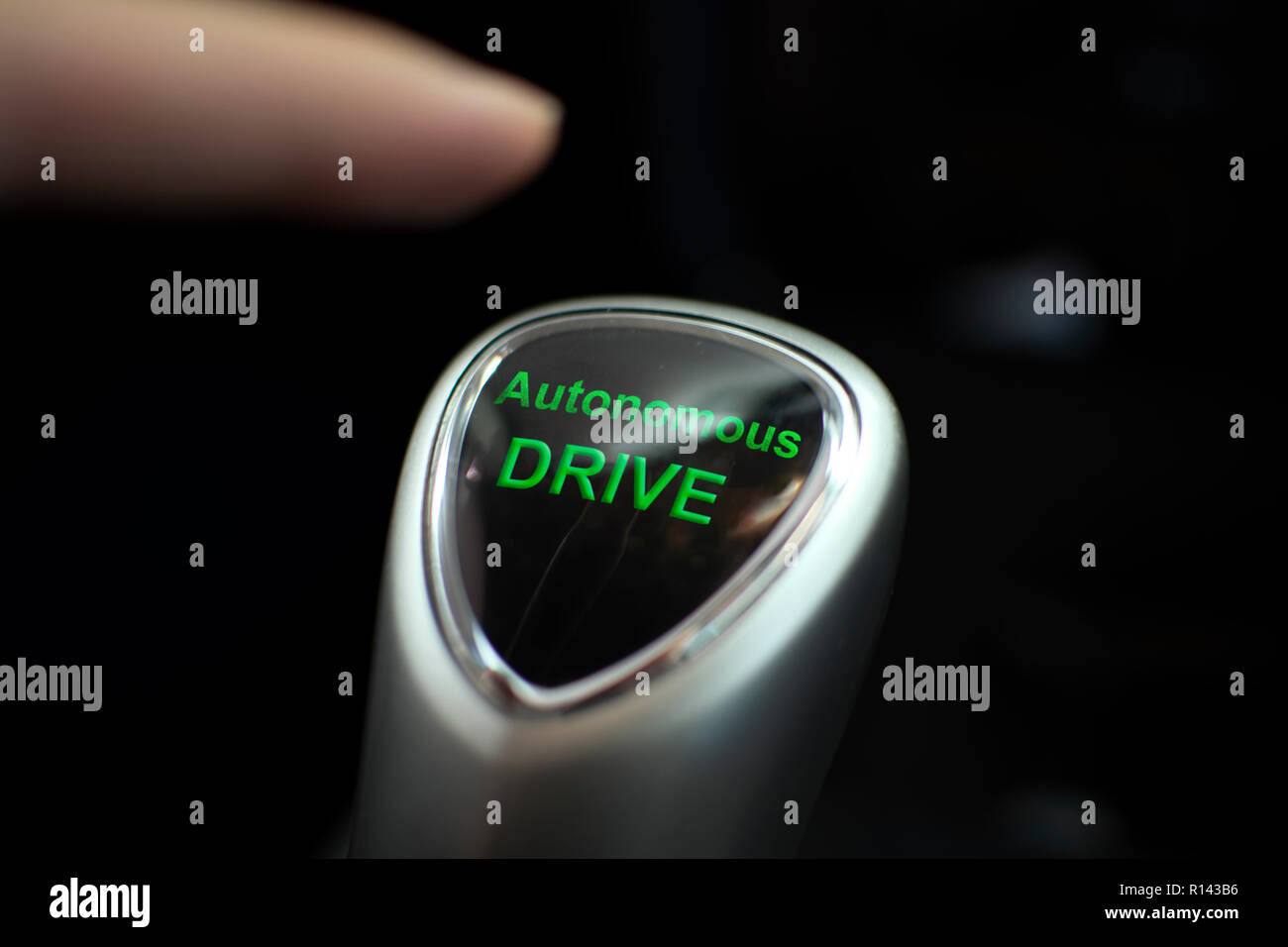 Autonomous drive button in an electric car Stock Photo
