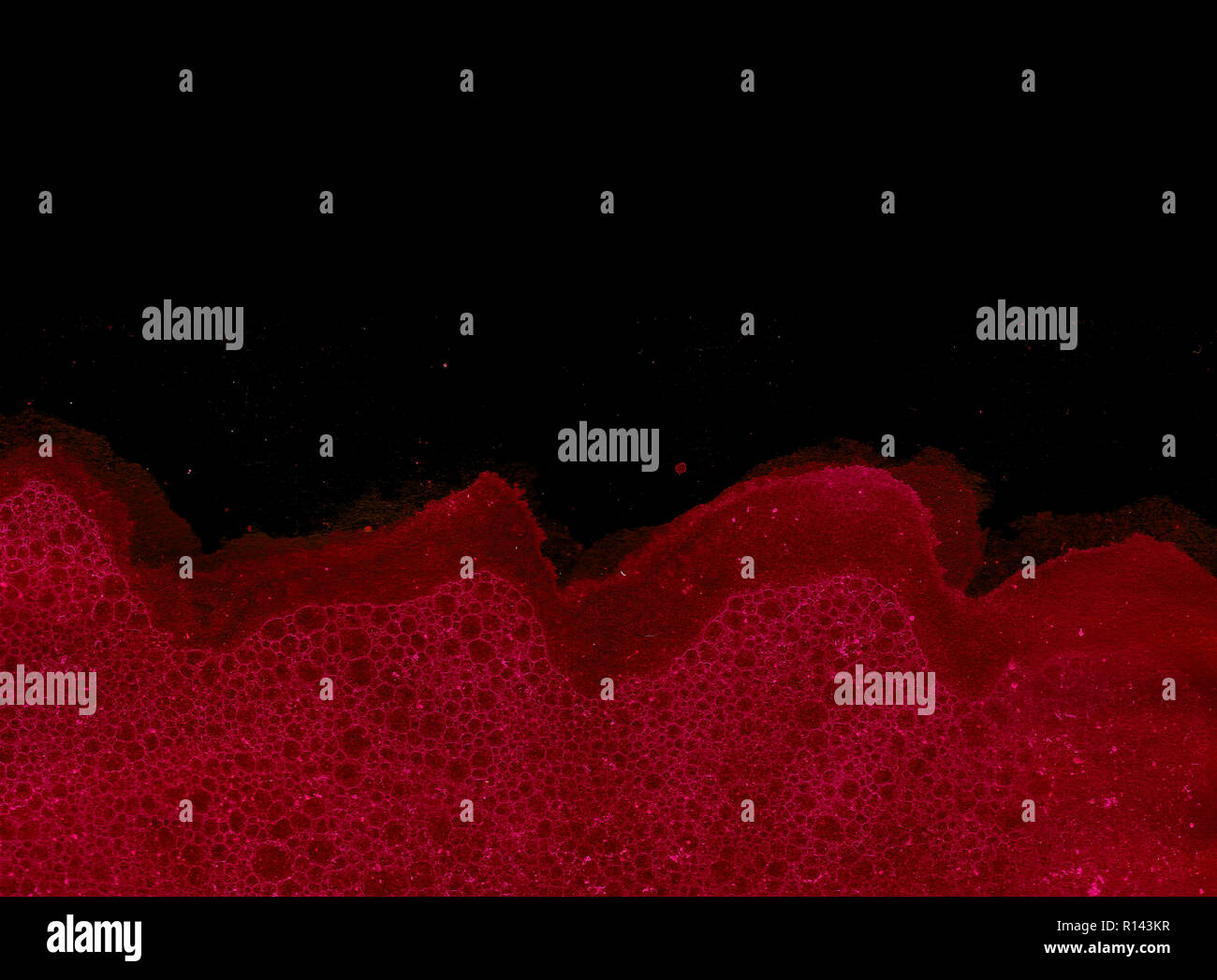 Abstract grunge cellular background against black Stock Photo