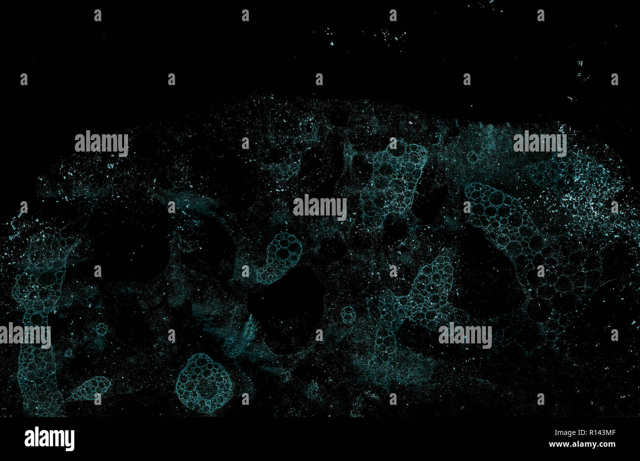Abstract grunge cellular background against black Stock Photo