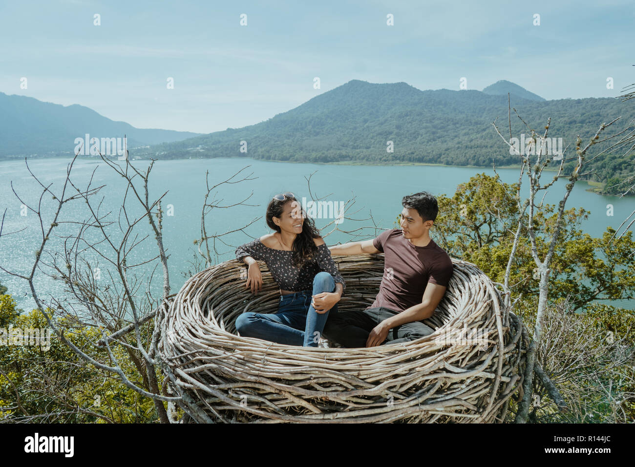 Boy girl sitting on hill hi-res stock photography and images - Alamy