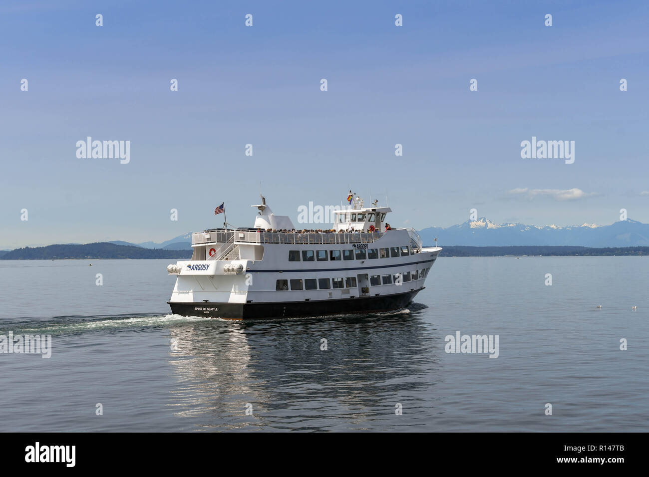 SEATTLE, WASHINGTON STATE, USA - JUNE 2018: Tourist sightseeing cruise boat sailing across elliott Bay in Seattle. Stock Photo