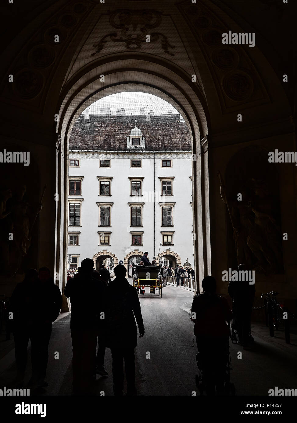 Vienna, Austria - November 1, 2018 - View of the Hofburg palace in Vienna city center. It's the historical royal palace. People are walking around to  Stock Photo