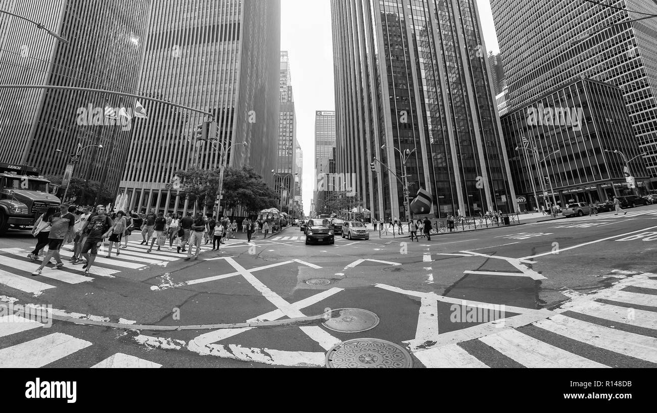 New York, USA - August 17, 2015: Black and white fisheye lens picture of Manhattan busy intersection at the Sixth Avenue. Stock Photo