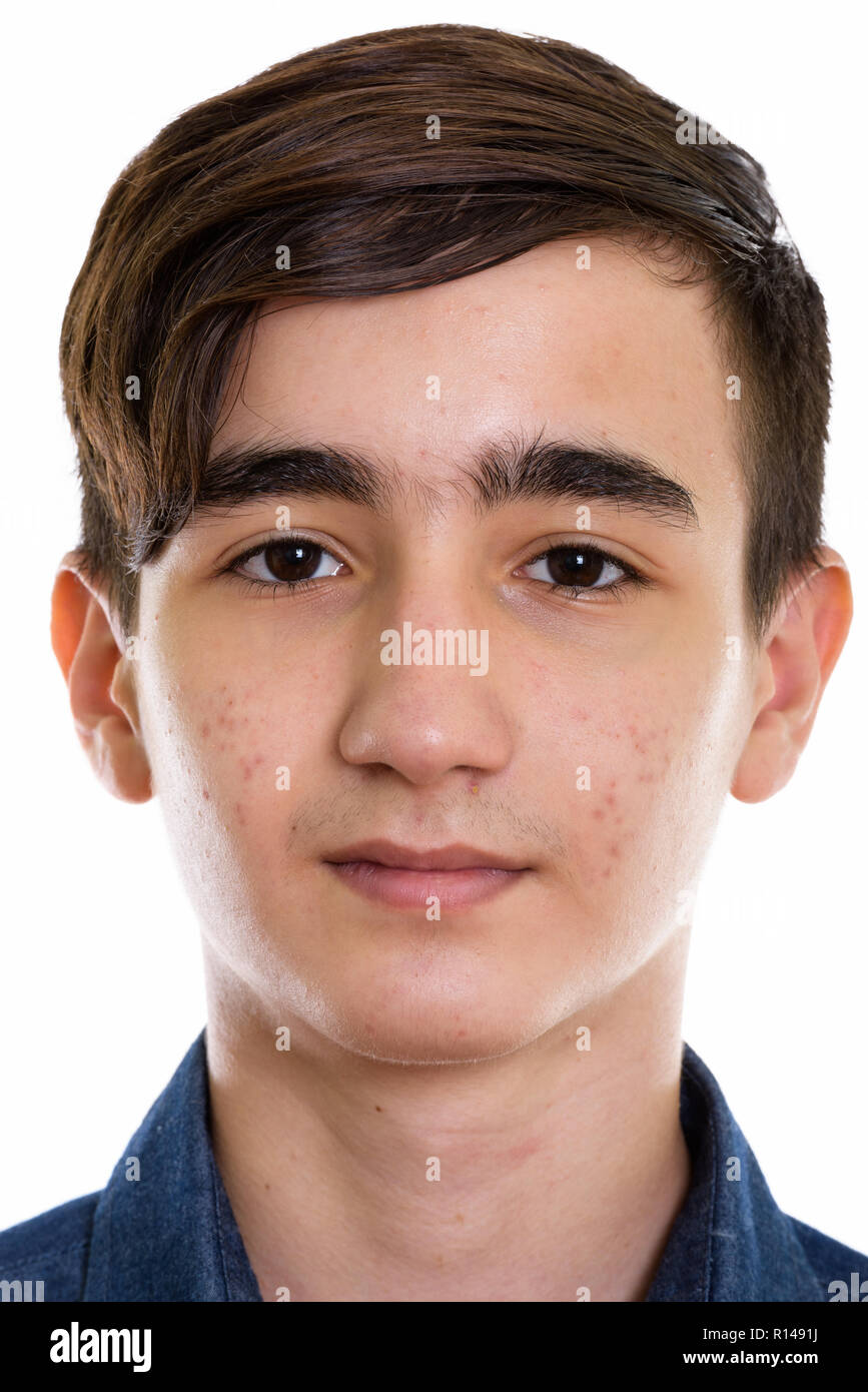 Face of young handsome Persian teenage boy Stock Photo