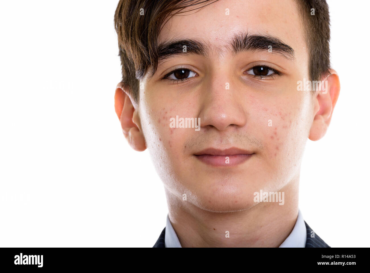 Close up of young handsome Persian teenage businessman Stock Photo
