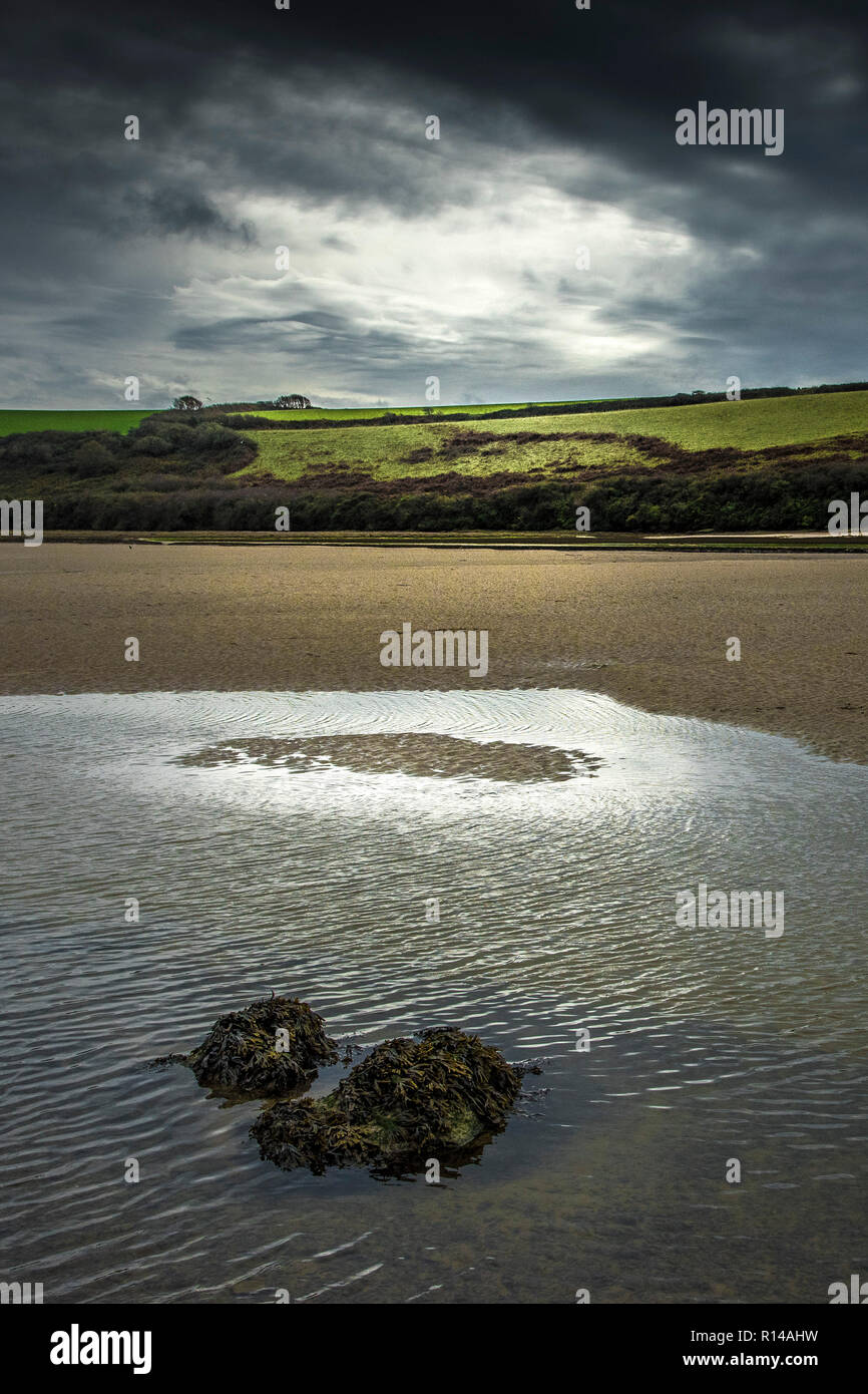 Late evening light at low tide in the Gannel Estuary in Newquay in Cornwall. Stock Photo