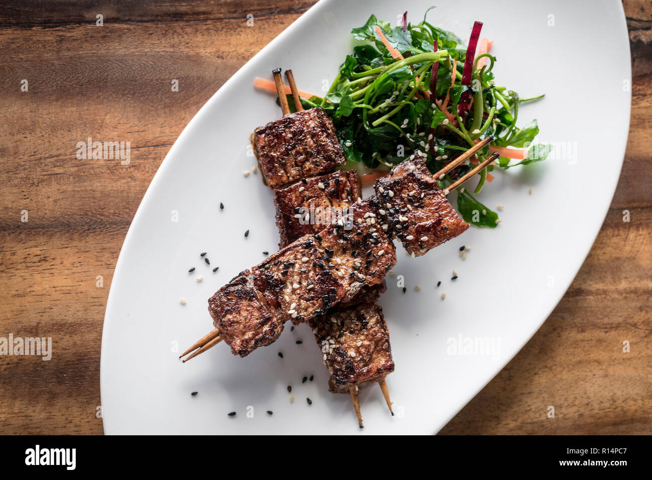 asian spicy sweet soy sauce and sesame seed grilled barbecue pork