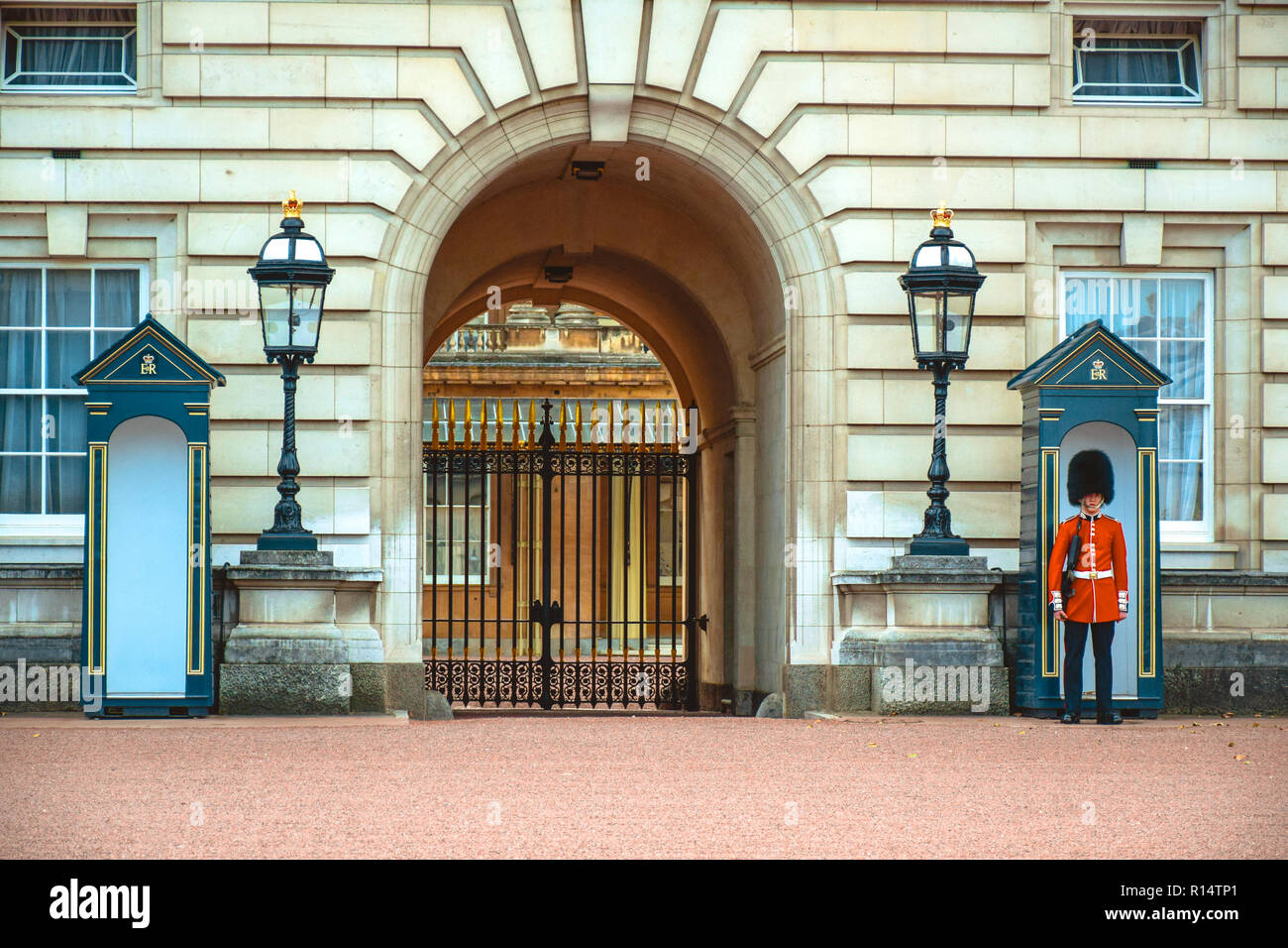 Armed royal grenadier guard standing his position at a sentry post in