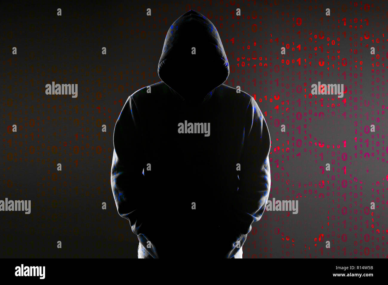 Silhouette Of An Anonymous Hacker In The Hood On The Background Of The Binary Code Stock Photo Alamy