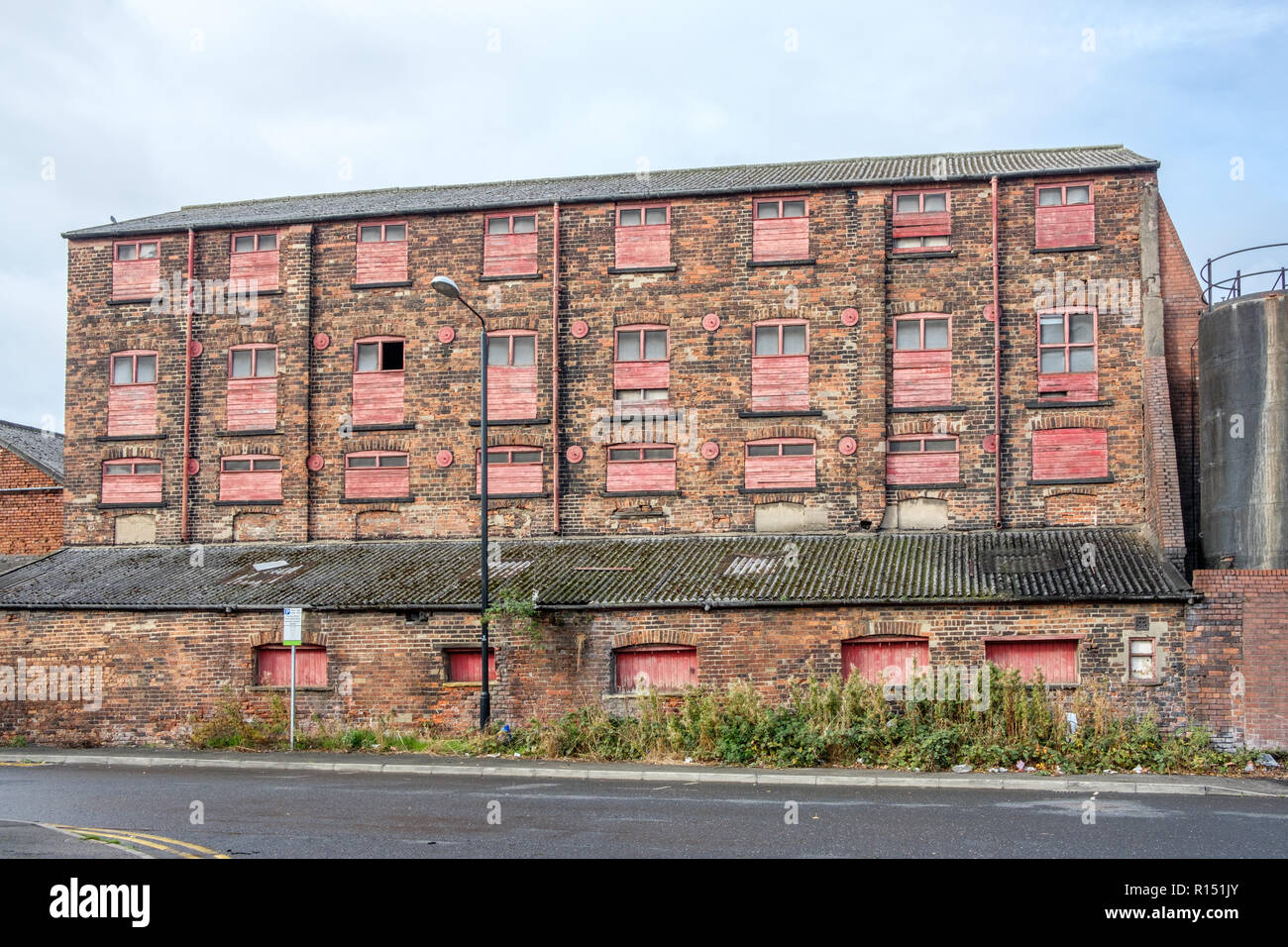 Old factory buildings in the vicinity of Granary Wharf in the city centre of Leeds, which is the largest town in West Yorkshire. Stock Photo