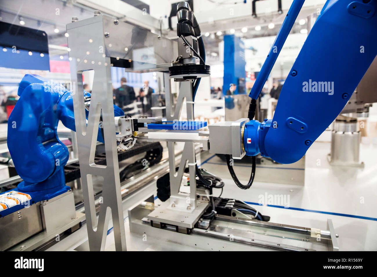 Robot arm in assembly line Stock Photo