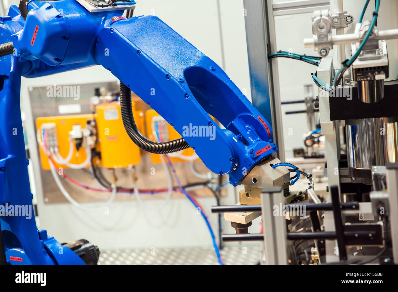 Robot arm in technology process Stock Photo